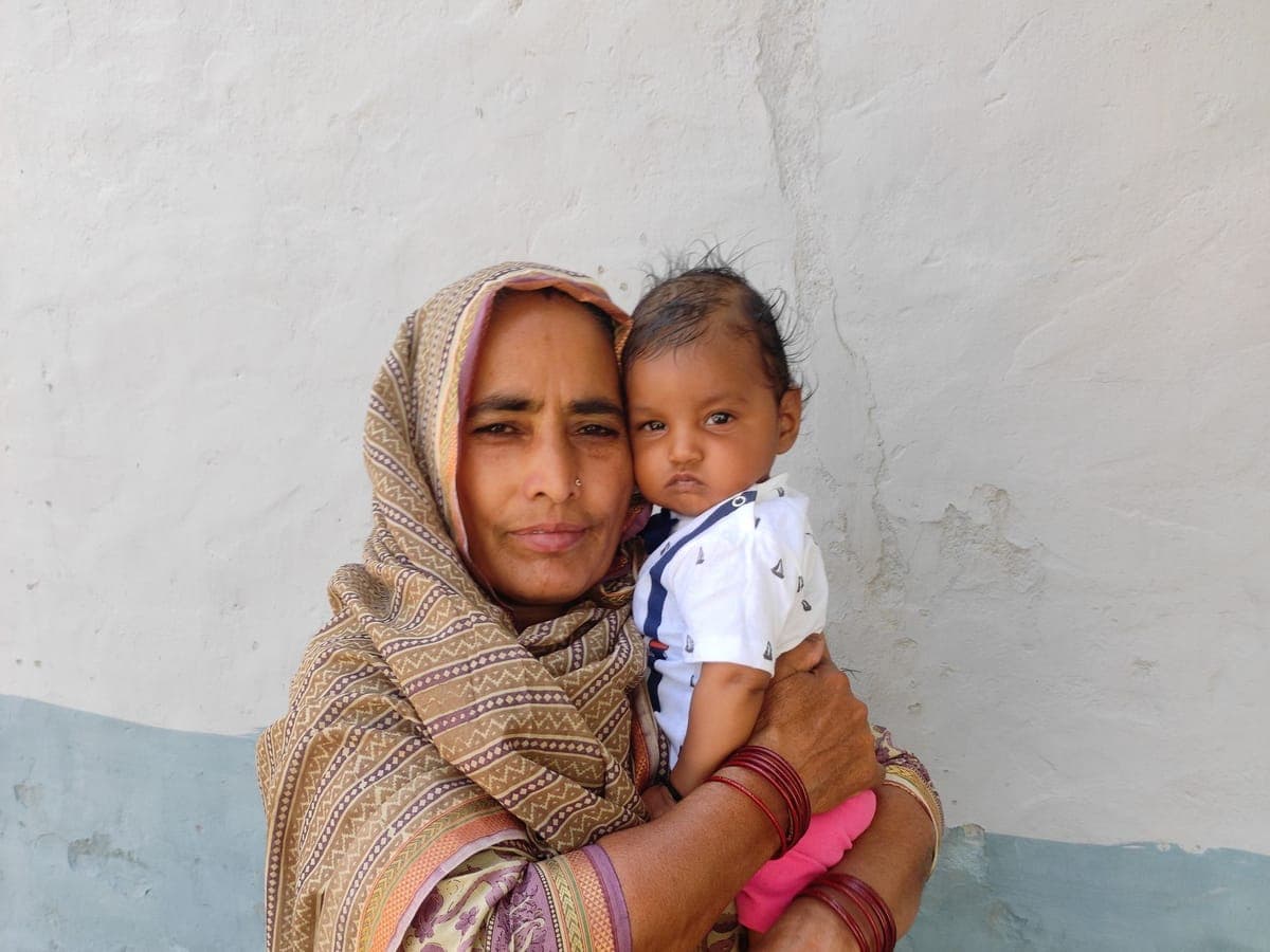 Woman holding a small baby in her arms