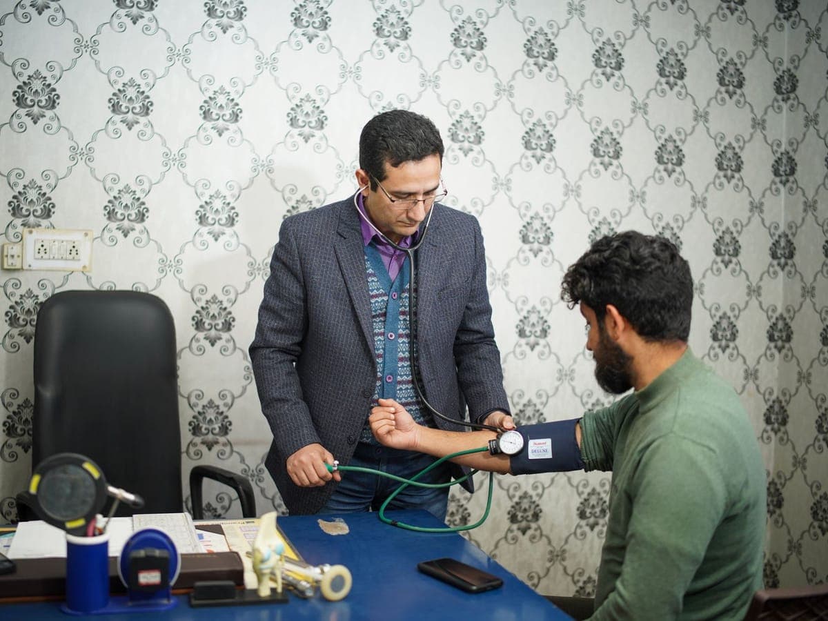 Doctor checking a patient's blood pressure
